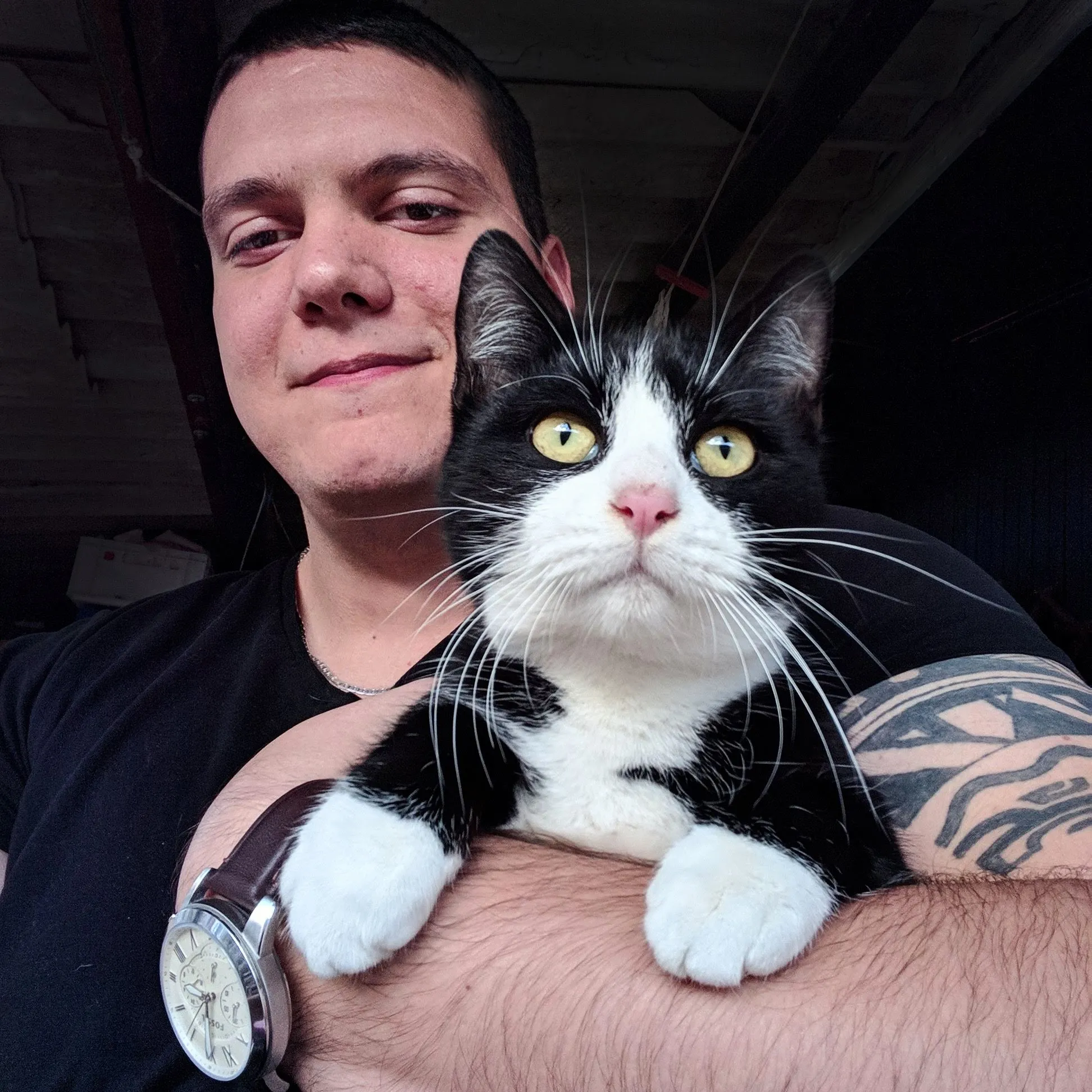 Ratko Solar holding his cat Cile